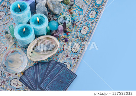 Tarot cards and crystals on a bohemian carpet for divination Tarot cards and crystals on a bohemian carpet for divination 137552032