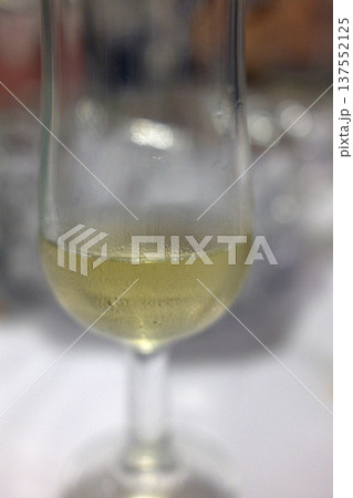 Champagne Glass with Sparkling Bubbles 137552125
