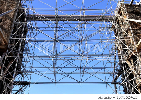 Complex metal scaffolding against a blue sky 137552413