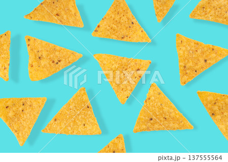 Cinco de Mayo, Tortilla chips scattered on background for celebration Cinco de Mayo, Tortilla chips scattered on background for celebration 137555564