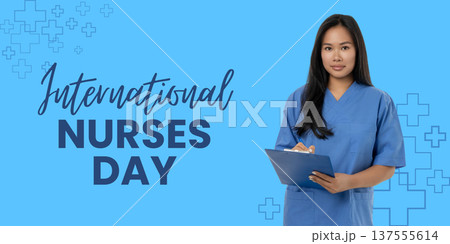 Nurses Day, A young woman holds a clipboard while wearing scrubs Nurses Day, A young woman holds a clipboard while wearing scrubs 137555614
