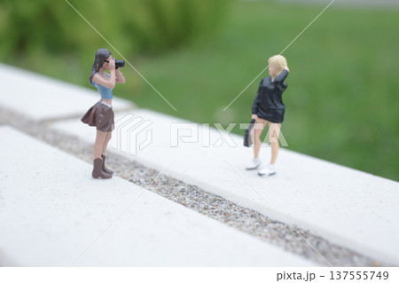 Tiny Photographer Captures Model Posing on Bright Ledge Tiny Photographer Captures Model Posing on Bright Ledge 137555749