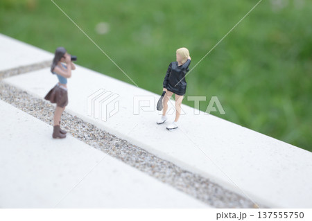 Tiny Photographer Captures Model Posing on Bright Ledge Tiny Photographer Captures Model Posing on Bright Ledge 137555750