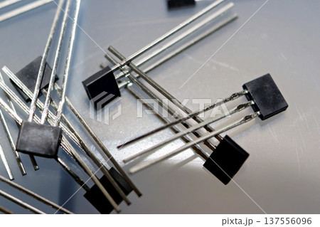 Essential 41F Hall effect sensors, core electronic components for precise electric bicycle motor control. Tech, DIY, and repair backdrop Essential 41F Hall effect sensors, core electronic components for precise electric bicycle motor control. Tech, DIY, and repair backdrop 137556096