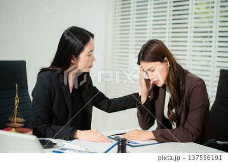Compassionate lawyer providing legal consultation and emotional support to client, concept of dispute resolution, corporate law, contract advice Compassionate lawyer providing legal consultation and emotional support to client, concept of dispute resolution, corporate law, contract advice 137556191