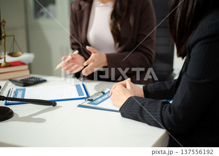 Compassionate lawyer providing legal consultation and emotional support to client, concept of dispute resolution, corporate law, contract advice 137556192