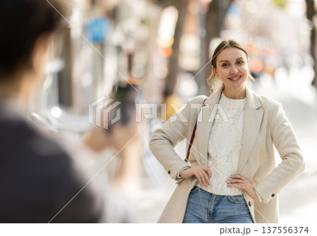 Girl poses during amateur shoot on street Girl poses during amateur shoot on street 137556374