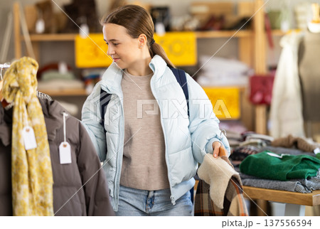 Teenage girl at winter clothes sale 137556594
