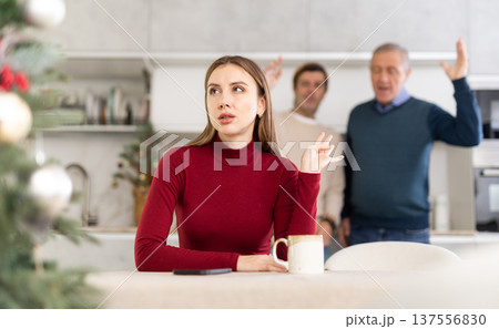 Two men quarreling with young woman 137556830