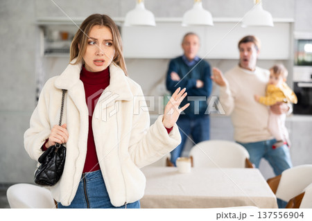 Men quarreling with girl Men quarreling with girl 137556904