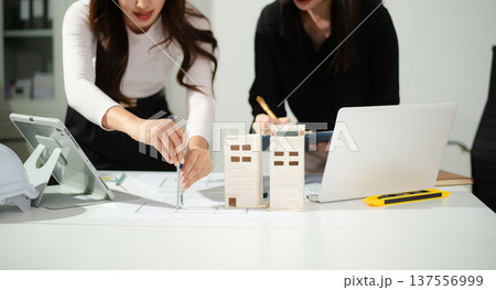 Business people having consultation about wind energy at company office. Asian industry professional team. 137556999