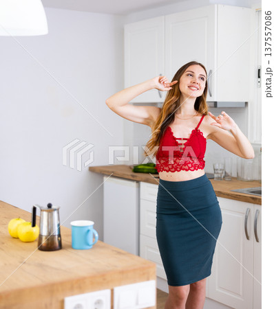 Portrait of attractive woman have fun dancing near table Portrait of attractive woman have fun dancing near table 137557086