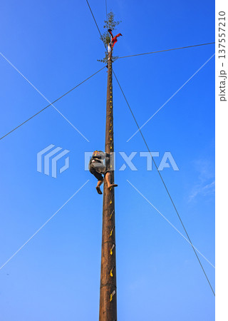 Traditional ladder climbing activity, climbers ascend step by step.      137557210