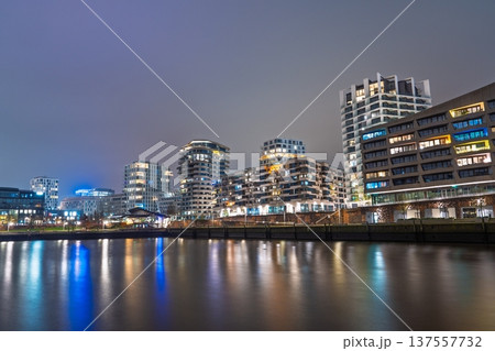 Hamburg Skyline at Night Illuminated Urban Architecture Reflecting on the Water, Germany Hamburg Skyline at Night Illuminated Urban Architecture Reflecting on the Water, Germany 137557732