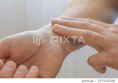 Checking Pulse On Wrist With Fingers 137558106