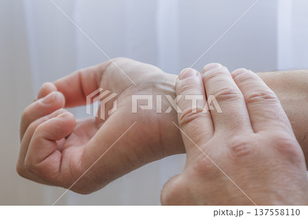 Checking Pulse On Wrist With Fingers 137558110