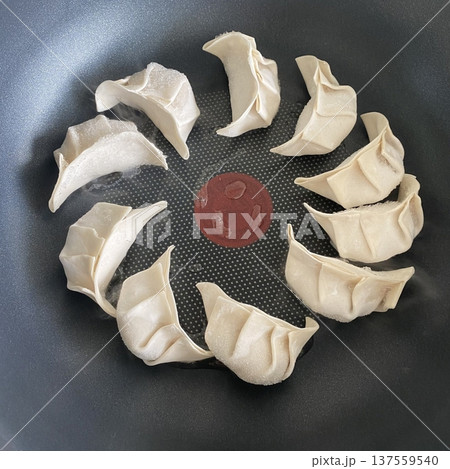 Korean dumplings filled with a mix of savory ingredients like ground meat, tofu, and vegetables. Mandu can be steamed, boiled, or pan-fried, making it a versatile and delicious snack or meal. 137559540