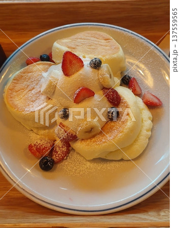 Fluffy souffle pancakes with a light, airy texture, served with fresh fruits, whipped cream, or syrup. These soft, melt-in-your-mouth pancakes are a delightful, indulgent treat perfect. Fluffy souffle pancakes with a light, airy texture, served with fresh fruits, whipped cream, or syrup. These soft, melt-in-your-mouth pancakes are a delightful, indulgent treat perfect. 137559565