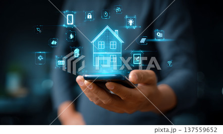 Smart home control interface with glowing house hologram and connected device icons, user operating smartphone with tech feel 137559652