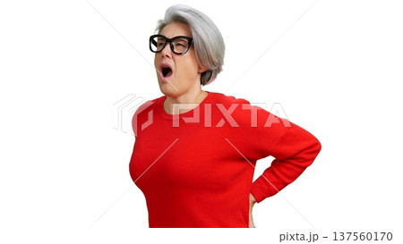 Senior woman experiencing lower back pain discomfort Senior woman experiencing lower back pain discomfort 137560170