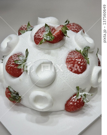Strawberry cake with soft fluffy layers, topped with fresh strawberries and smooth cream, showcasing vibrant red fruit, delicate textures, and sweet inviting appearance in close-up detail Strawberry cake with soft fluffy layers, topped with fresh strawberries and smooth cream, showcasing vibrant red fruit, delicate textures, and sweet inviting appearance in close-up detail 137560649