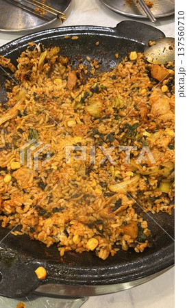 Bokkeumbap, a Korean fried rice dish, often made with kimchi or other vegetables, meats, and seasoned with savory spices. A comforting and flavorful meal! 137560710