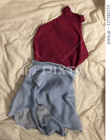 Stack of neatly folded clothes in various colors and fabrics, showing layered textures, soft materials, and stylish casual outfits prepared for daily wear, highlighting a trendy OOTD concept in detail 137560715