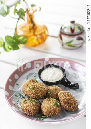 chicken croquetas with aioli sauce tapas snack on white table in spanish restaurant chicken croquetas with aioli sauce tapas snack on white table in spanish restaurant 137562248
