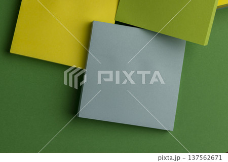 paper for notes on green paper, stationery made of thin paper with glue on one side for ease of use and gluing, close up 137562671