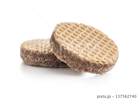 Stacked Chocolate Wafer Biscuits With Cream Layers On White Background. Sweet Dessert Snack Stacked Chocolate Wafer Biscuits With Cream Layers On White Background. Sweet Dessert Snack 137562740