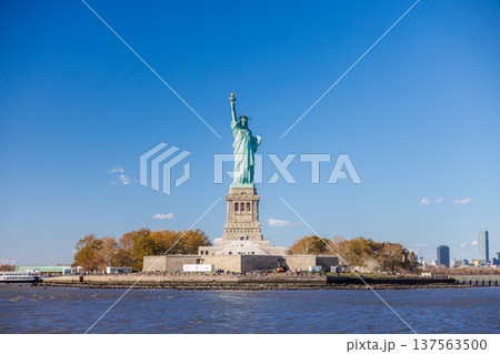 Statue of Liberty on Liberty Island with clear blue sky in New York Harbor Statue of Liberty on Liberty Island with clear blue sky in New York Harbor 137563500