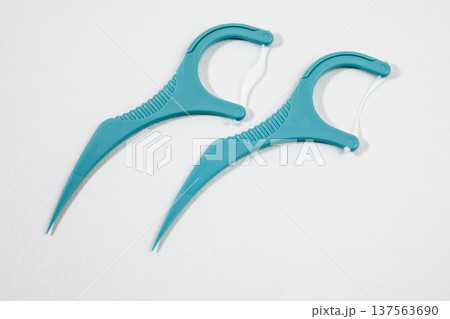 Two Dental Floss Picks Isolated On White Background Closeup Two Dental Floss Picks Isolated On White Background Closeup 137563690