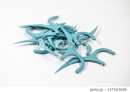 Pile Of Dental Floss Picks Closeup Isolated On White Background Pile Of Dental Floss Picks Closeup Isolated On White Background 137563696