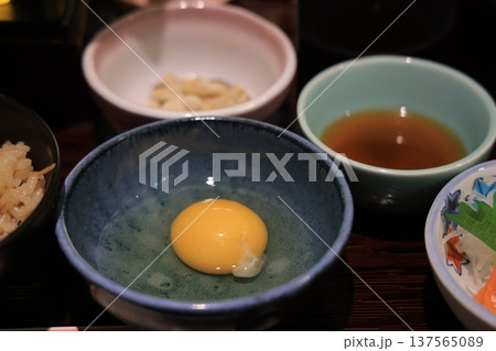 Nov 25 2025 Soft Egg Yolk In Blue Ceramic Bowl With Rice, Tea, 137565089
