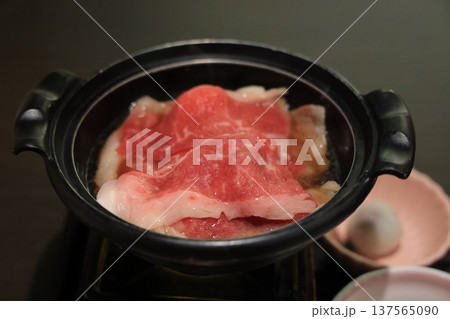 Nov 25 2025 Delicious Thin Beef Slices Simmering in a Traditional Hot Pot Nov 25 2025 Delicious Thin Beef Slices Simmering in a Traditional Hot Pot 137565090