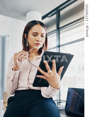 Woman in workplace with tablet, thinking and reading review online, HR schedule or email for feedback. Research, networking and communication on digital app, businesswoman at human resources agency. Woman in workplace with tablet, thinking and reading review online, HR schedule or email for feedback. Research, networking and communication on digital app, businesswoman at human resources agency. 137569585