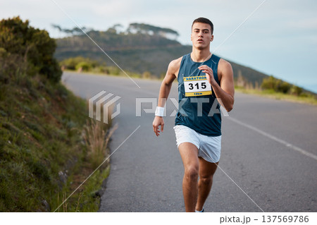 Fitness, nature and man athlete running for race, marathon or competition training on mountain. Sports, workout and young male runner doing an outdoor cardio exercise for endurance, speed or health. 137569786