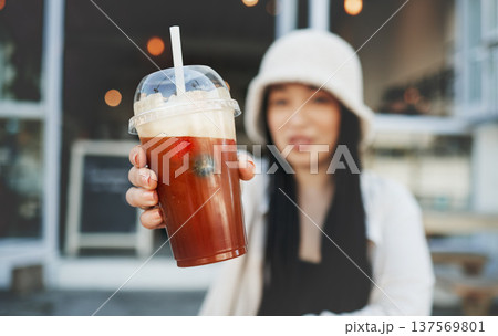 Woman hand, smoothie and closeup outdoor at a restaurant and drink from cafe. Milkshake, coffee shop and gen z fashion of a female person with a straw on break on diner patio with blurred background Woman hand, smoothie and closeup outdoor at a restaurant and drink from cafe. Milkshake, coffee shop and gen z fashion of a female person with a straw on break on diner patio with blurred background 137569801