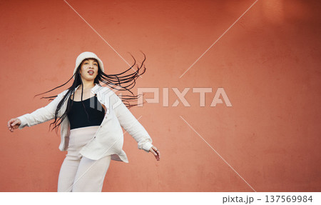 Fashion, space and an urban woman on a red background for freedom, energy or unique street style. Wall, mock up and hip hop with a young gen z person on a color backdrop for marketing or advertising Fashion, space and an urban woman on a red background for freedom, energy or unique street style. Wall, mock up and hip hop with a young gen z person on a color backdrop for marketing or advertising 137569984