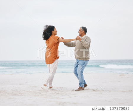 Beach, dance and senior happy couple love, fun date or care on travel holiday, retirement or nature vacation energy. Free dancer, ocean sea and elderly man, old woman and marriage people bond on sand 137570085