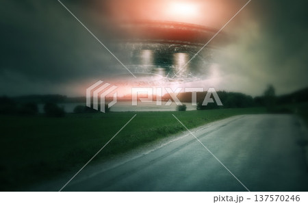 UFO, spaceship and countryside with alien in sky for fantasy or science fiction event in nature, field or landscape with clouds. Earth, aliens and extraterrestrial drone in environment with blur UFO, spaceship and countryside with alien in sky for fantasy or science fiction event in nature, field or landscape with clouds. Earth, aliens and extraterrestrial drone in environment with blur 137570246