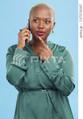 Phone call, thinking and black woman listening to news, discussion and talk to contact in studio isolated on a blue background. Idea, African person chat on smartphone conversation and communication 137570287