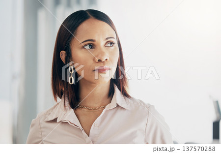 Serious, thinking and business woman in office, planning or problem solving in creative startup. Future vision, idea or professional decision making, brainstorming solution or inspiration of strategy 137570288