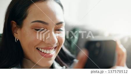Home, smile and woman with a cellphone, connection and digital app with social media, funny meme or online reading. Person, mobile user or girl with a smartphone, search internet or network with post 137570512