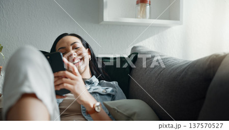 Home, relax and woman with a cellphone, typing and connection with social media, contact and digital app. Person, mobile user or girl with a smartphone, funny meme or network with email notification 137570527