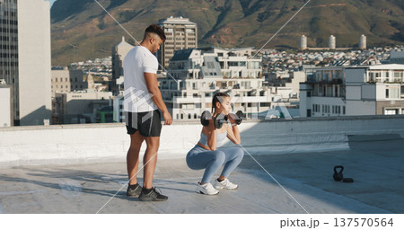 Personal trainer, fitness and a woman outdoor with dumbbells for exercise, workout or training rooftop. Couple of friends in urban city for squats, strong muscle or bodybuilder and lifting weights Personal trainer, fitness and a woman outdoor with dumbbells for exercise, workout or training rooftop. Couple of friends in urban city for squats, strong muscle or bodybuilder and lifting weights 137570564