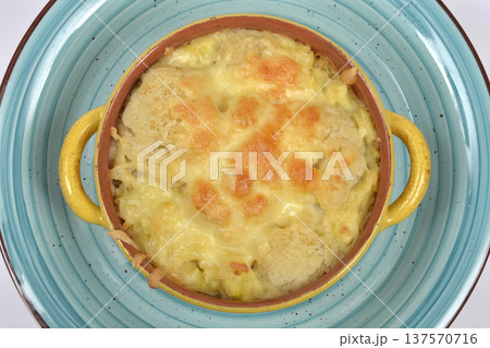 Baked cauliflower and mashed potatoes with cheese in yellow bowl Baked cauliflower and mashed potatoes with cheese in yellow bowl 137570716