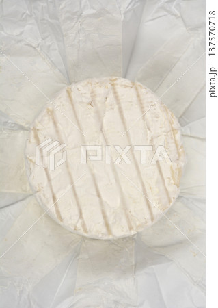 Top view of round blue cheese on white paper Top view of round blue cheese on white paper 137570718