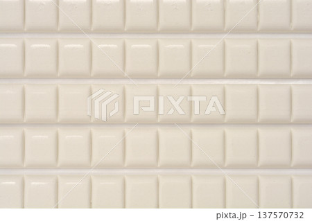 Close up of white adhesive mounting putty squares Close up of white adhesive mounting putty squares 137570732