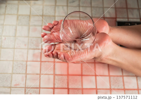 Foot fetish. A woman holds a wine glass in the shower. 137571112
